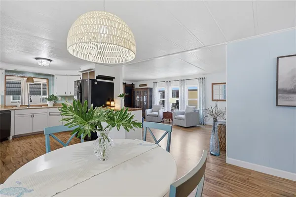 a view of a livingroom with furniture and a chandelier
