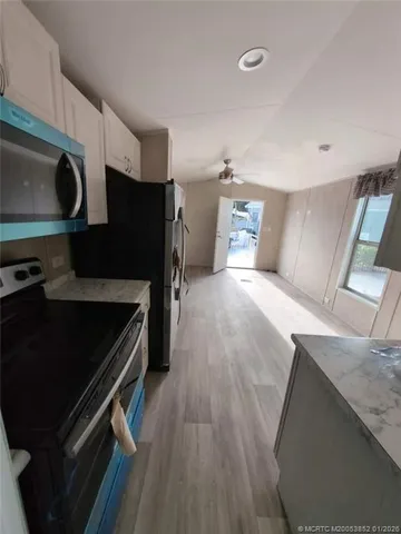a kitchen with a stove and a microwave