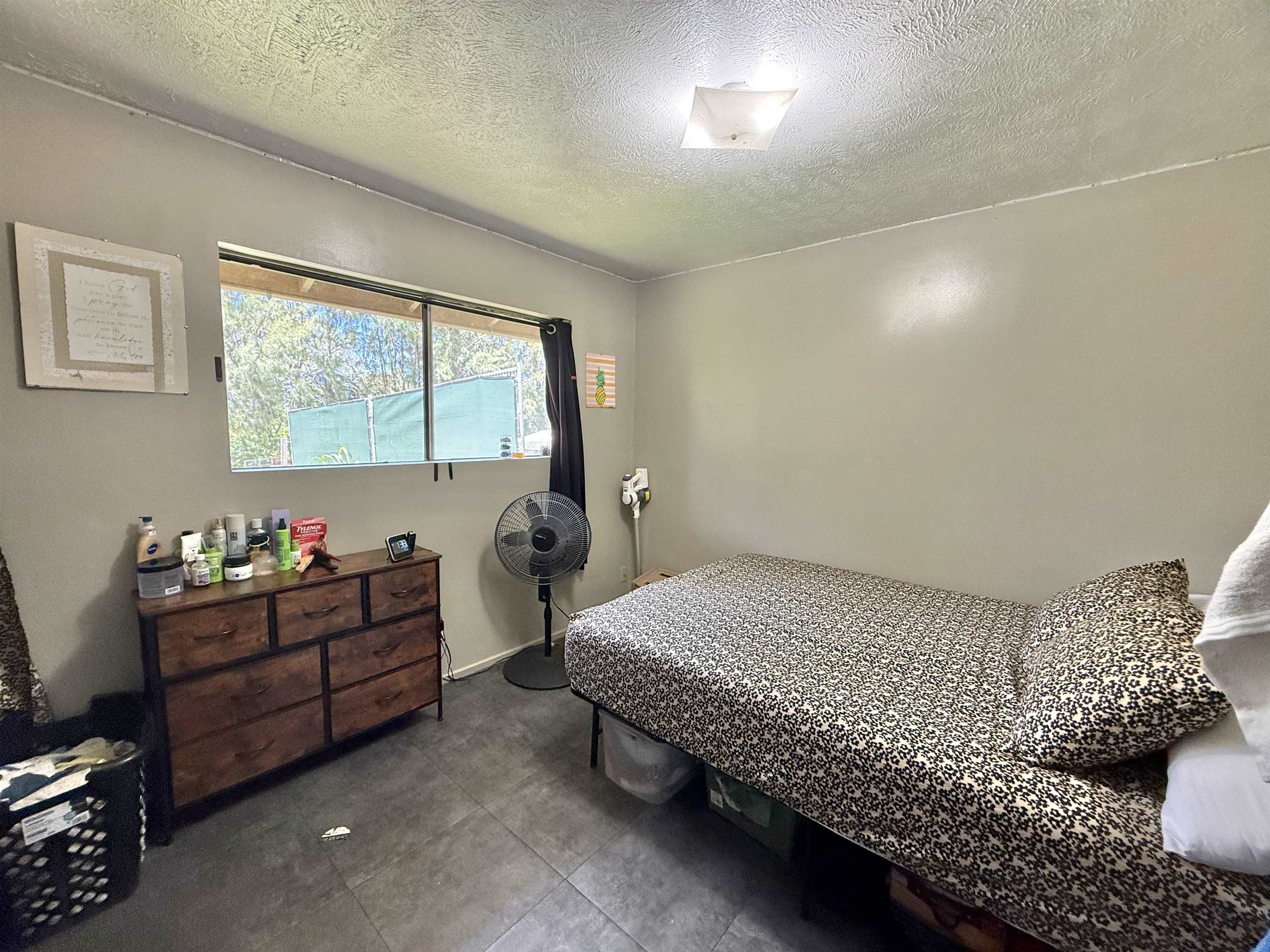 1630 Kauhikoa Road Haiku, HI 96708 - Photo 29 of 48 a bedroom with bed and window