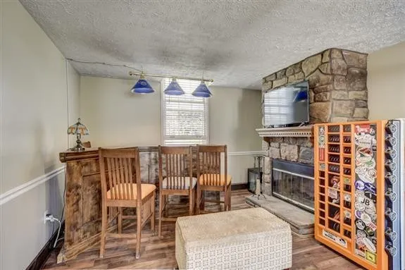 a view of a livingroom with furniture and a window