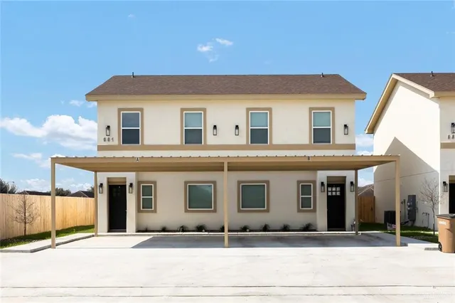 a front view of a house with garage