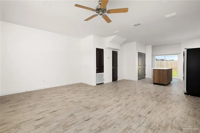 a view of an empty room with a stove