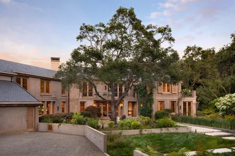 front view of a house with a garden