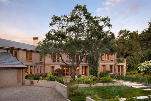 front view of a house with a garden