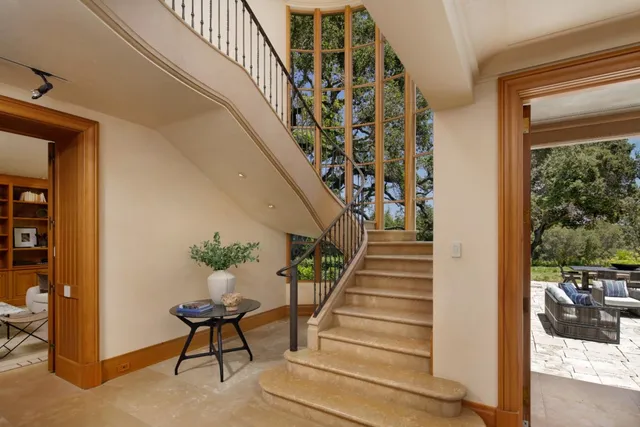 a bedroom with furniture and a fireplace