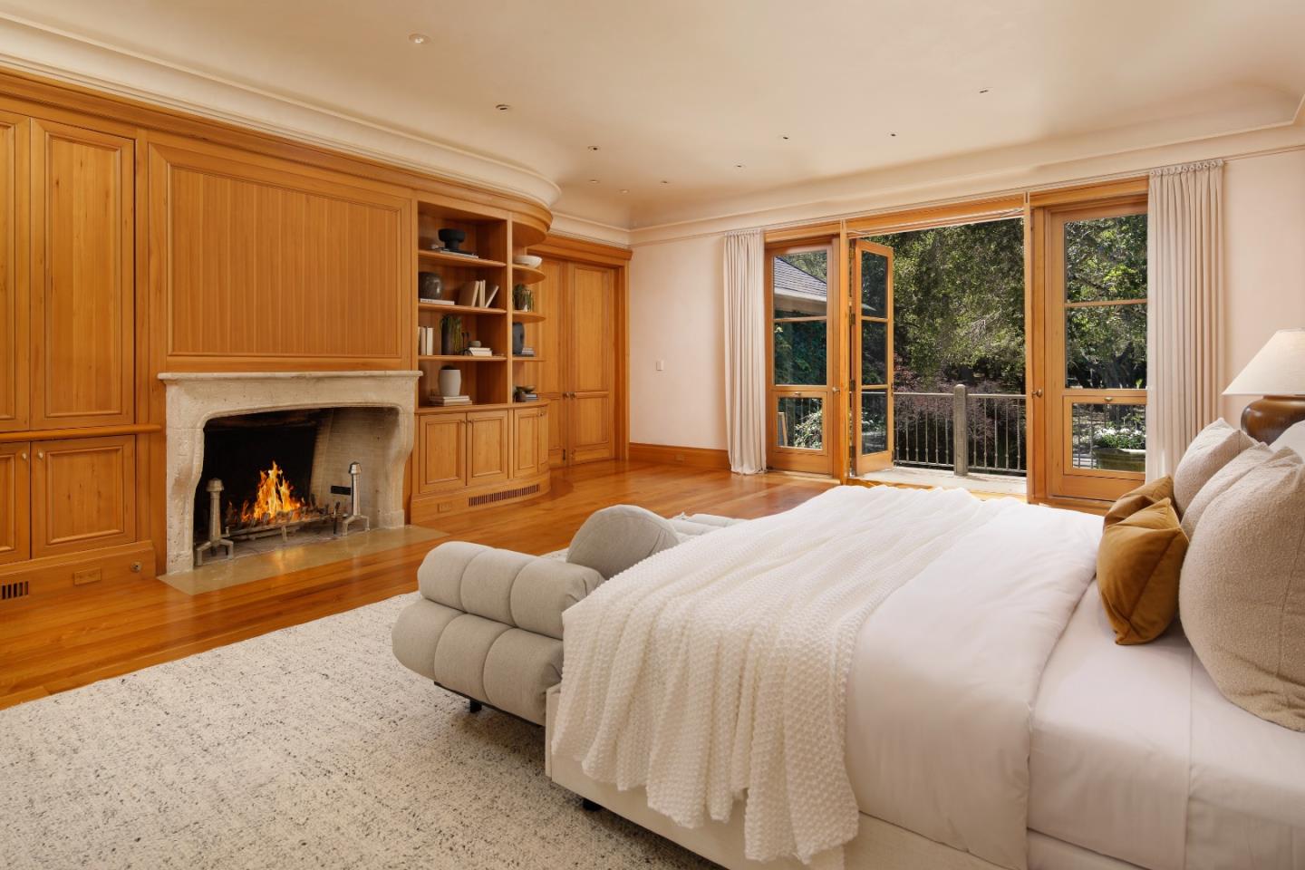 211 Winding Way Woodside, CA 94062 - Photo 16 of 32 a bedroom with furniture and a fireplace