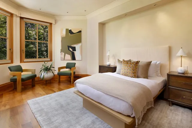 a bathroom with a sink a large mirror and a bathtub