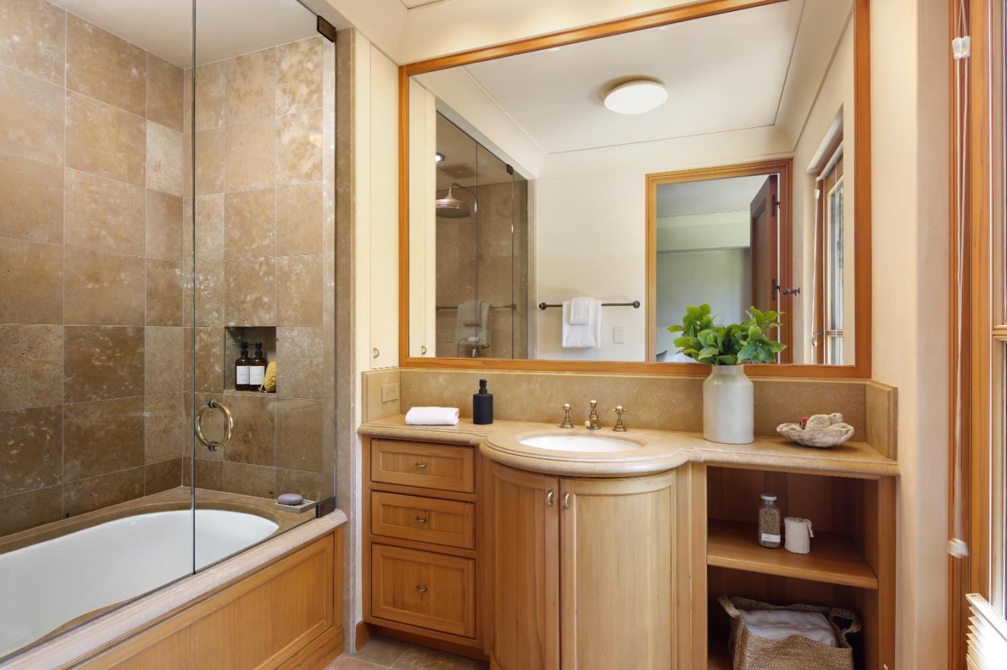 211 Winding Way Woodside, CA 94062 - Photo 20 of 32 a bathroom with a sink a large mirror and a bathtub