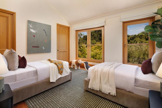 a bathroom with a granite countertop sink toilet and mirror