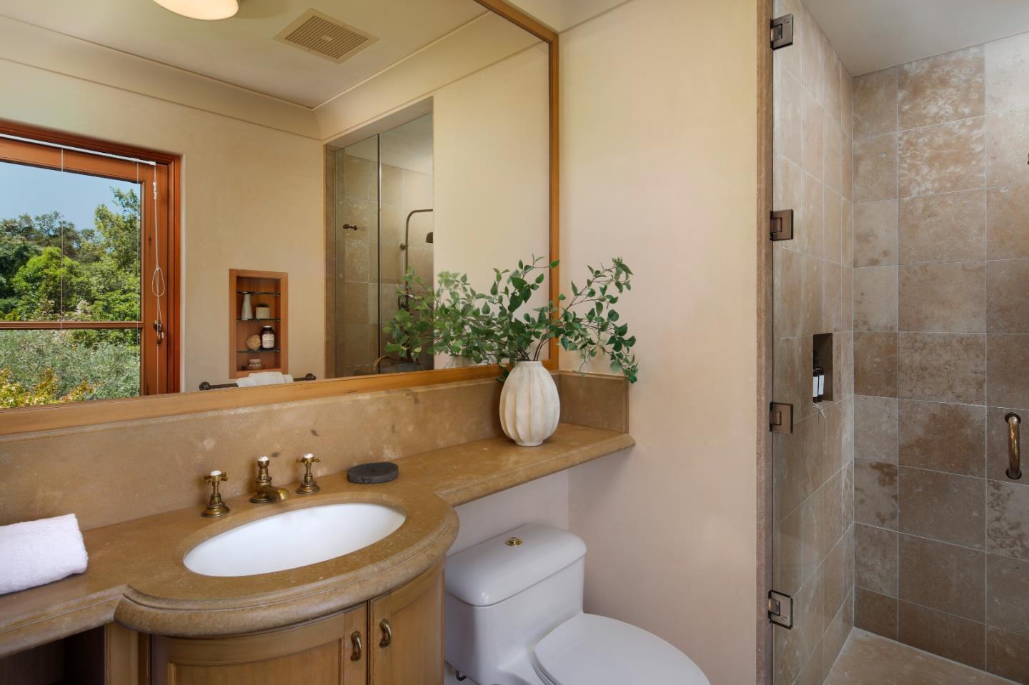211 Winding Way Woodside, CA 94062 - Photo 22 of 32 a bathroom with a granite countertop sink toilet and mirror