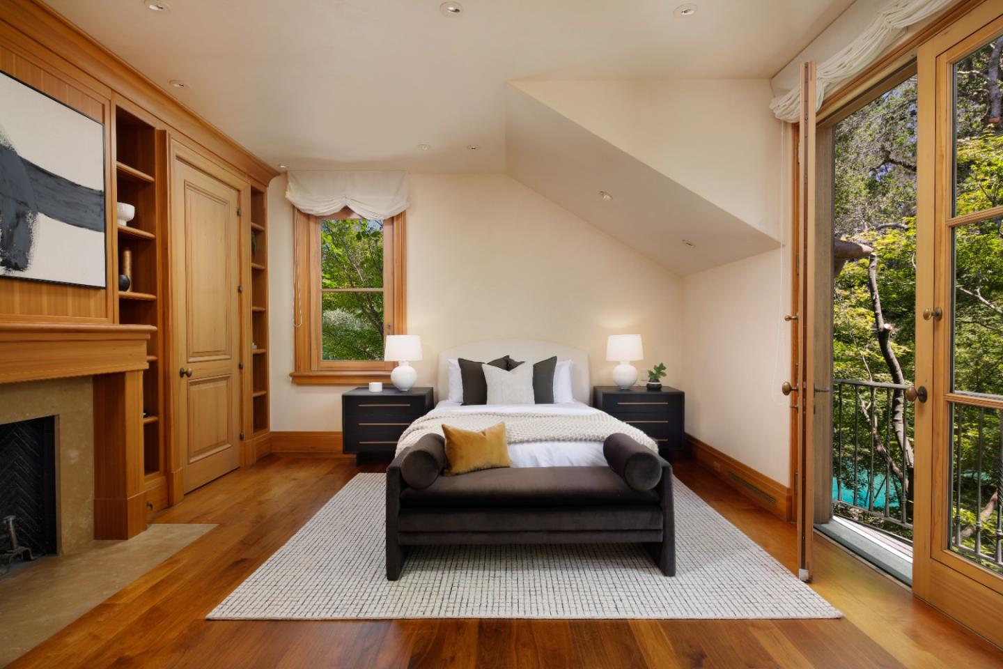 211 Winding Way Woodside, CA 94062 - Photo 23 of 32 a bedroom with a bed wooden floor and window