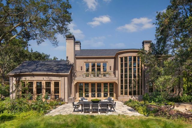 an aerial view of a house with yard swimming pool and outdoor seating