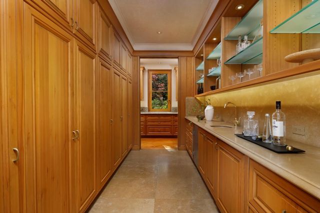 a kitchen with a stove and a refrigerator