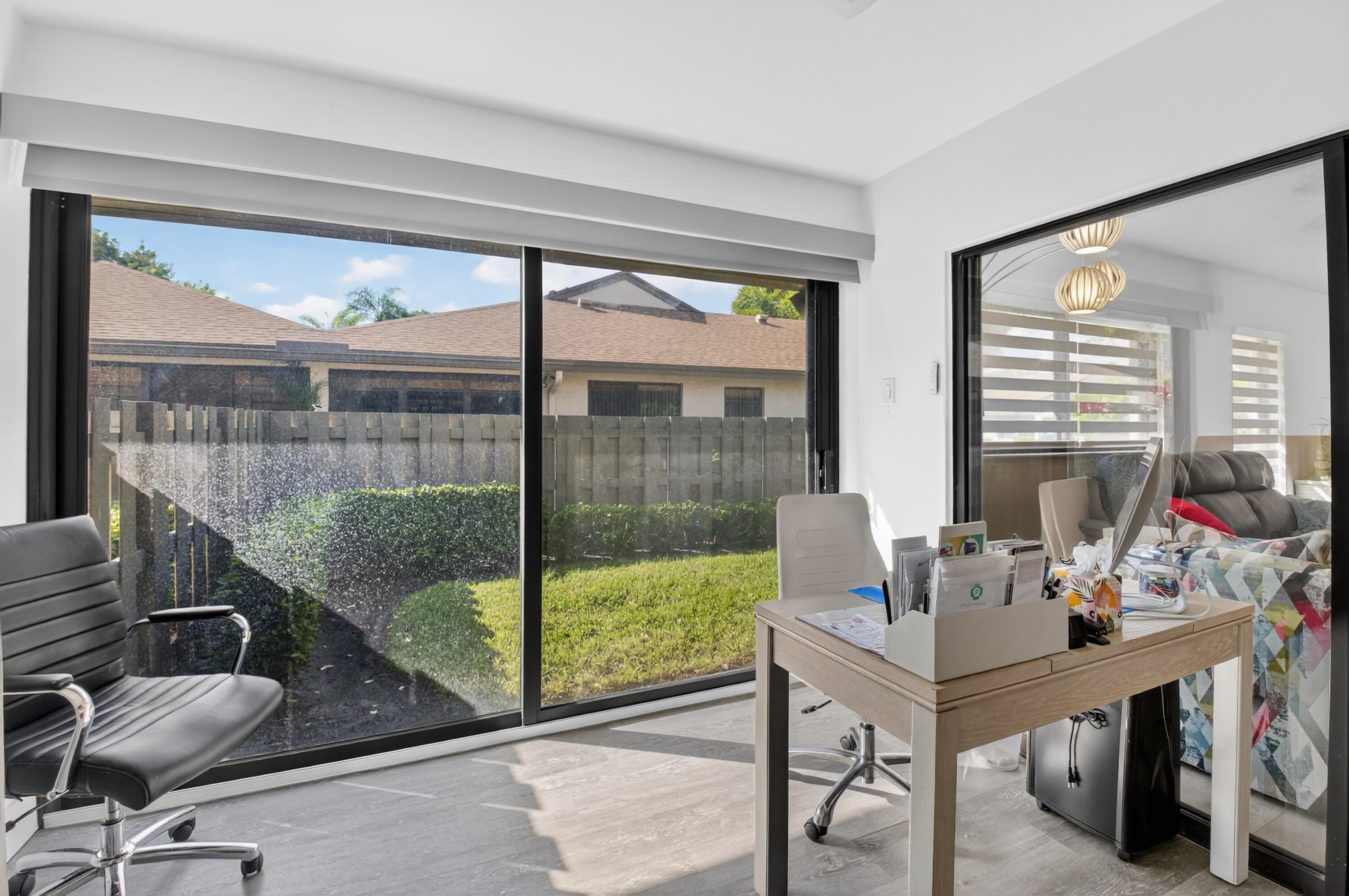 8136 Whispering Palm Drive, Unit B Boca Raton, FL 33496 - Photo 25 of 37 a view of a workspace with furniture and a window