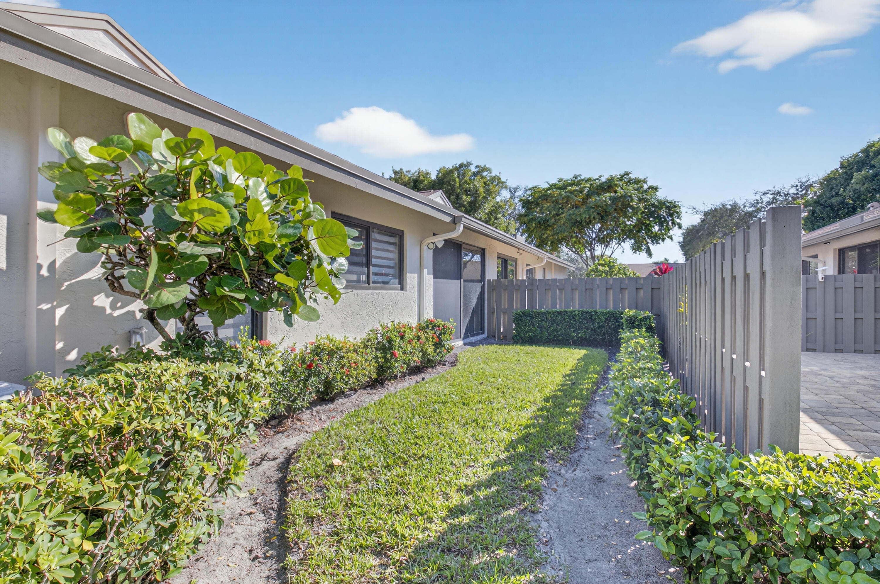 8136 Whispering Palm Drive, Unit B Boca Raton, FL 33496 - Photo 28 of 37 a view of a garden with pathway