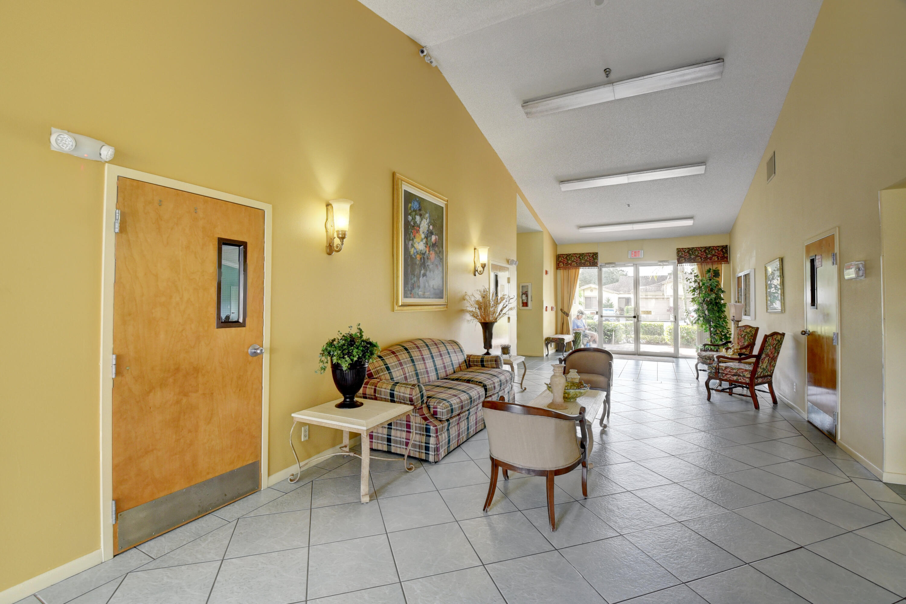 8136 Whispering Palm Drive, Unit B Boca Raton, FL 33496 - Photo 31 of 37 a living room with furniture a dining table and chairs