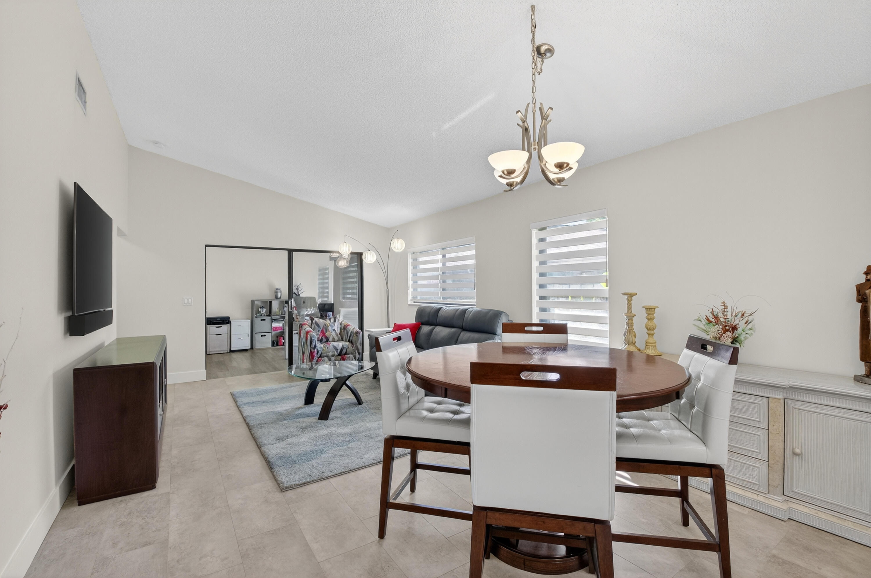 8136 Whispering Palm Drive, Unit B Boca Raton, FL 33496 - Photo 6 of 37 a view of a livingroom with furniture and window