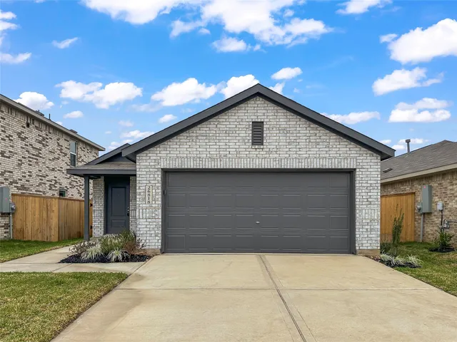 a front view of house with garage and yard