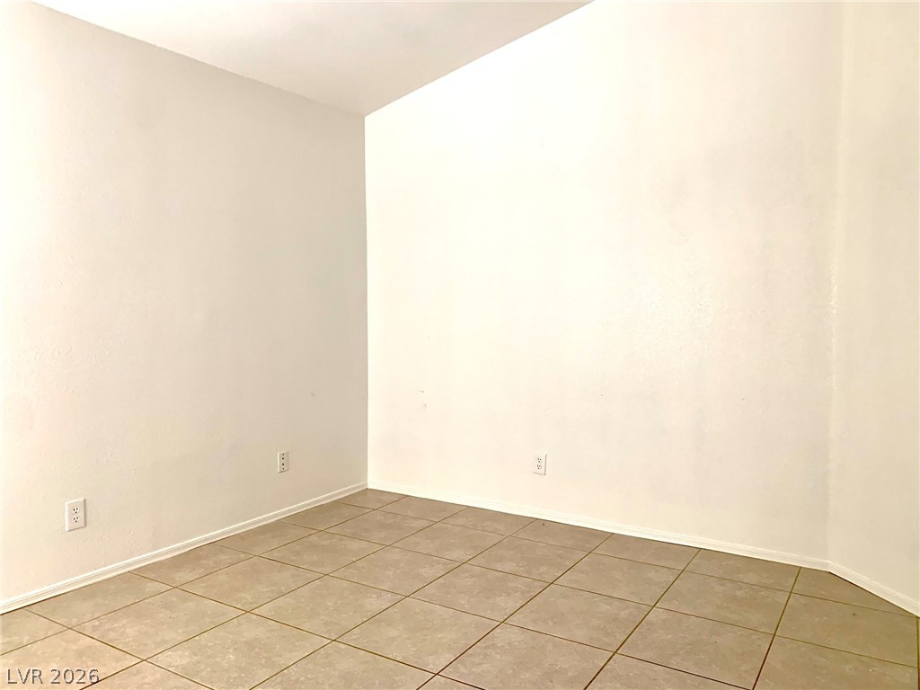3821 Bombastic Court Las Vegas, NV 89147 - Photo 21 of 36 This versatile interior space features durable tile flooring, ready for your personalized design touches.