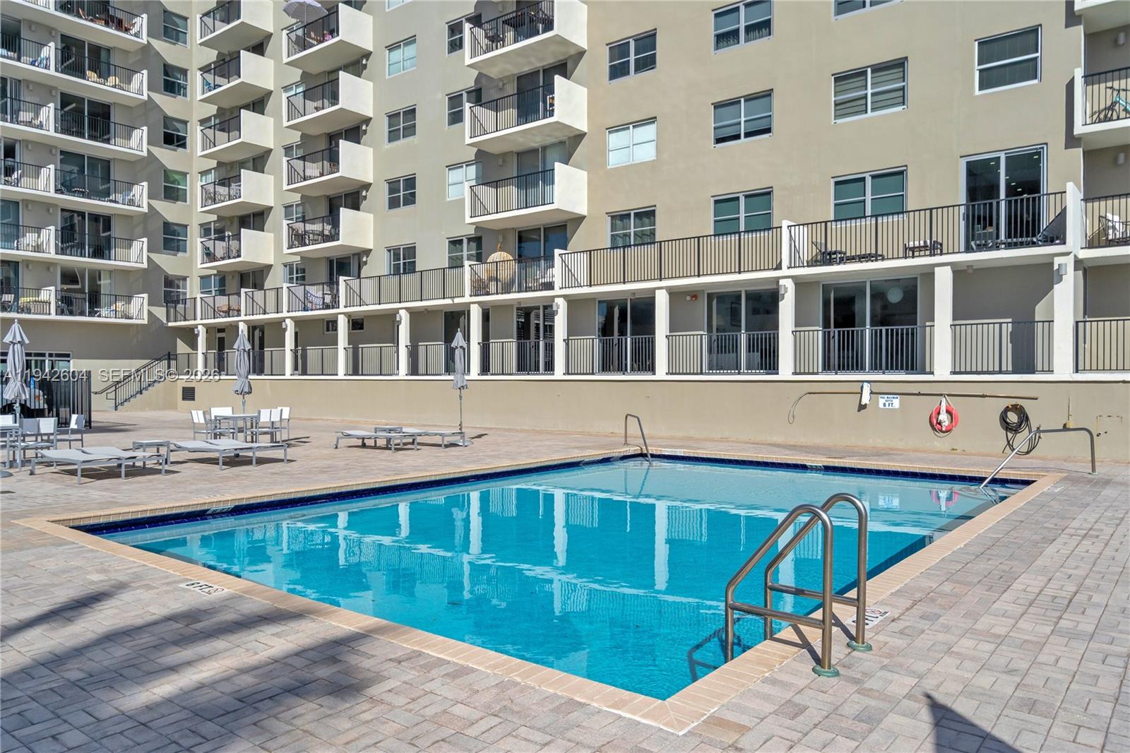 9273 Collins Avenue, Unit 503 Surfside, FL 33154 - Photo 30 of 48 a front view of a building with a swimming pool