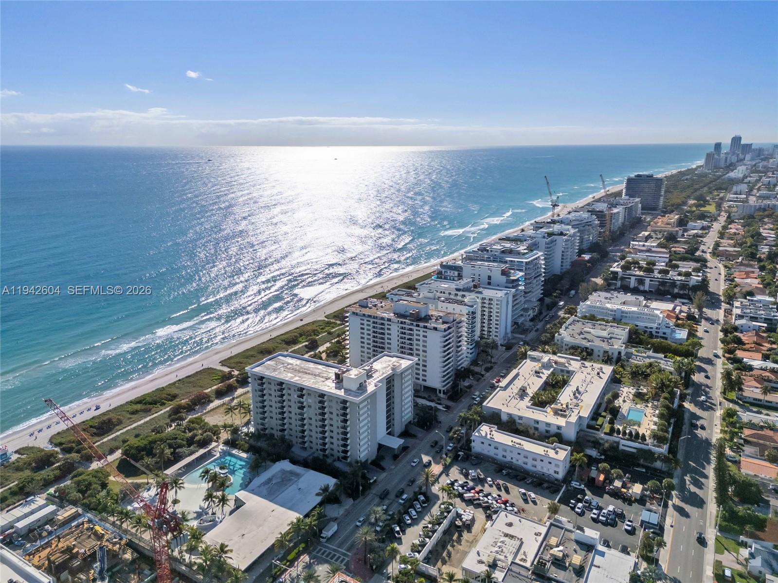 9273 Collins Avenue, Unit 503 Surfside, FL 33154 - Photo 41 of 48 a view of a balcony with chairs and wooden floor