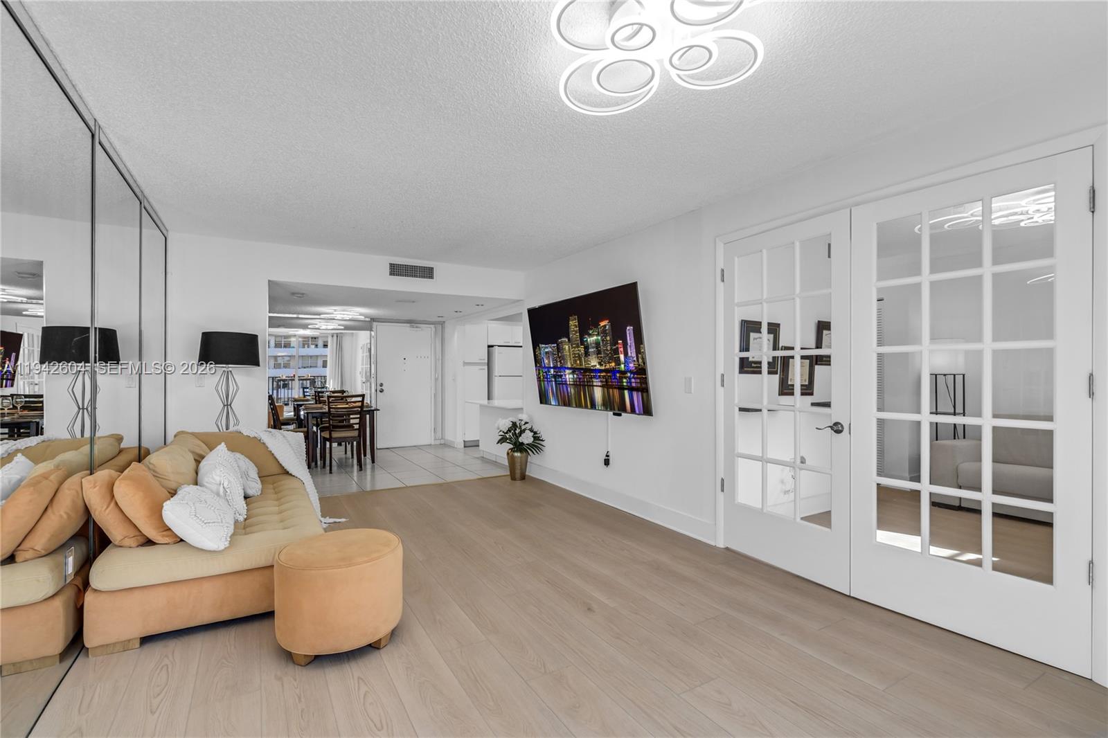 9273 Collins Avenue, Unit 503 Surfside, FL 33154 - Photo 6 of 48 a living room with furniture and a large window