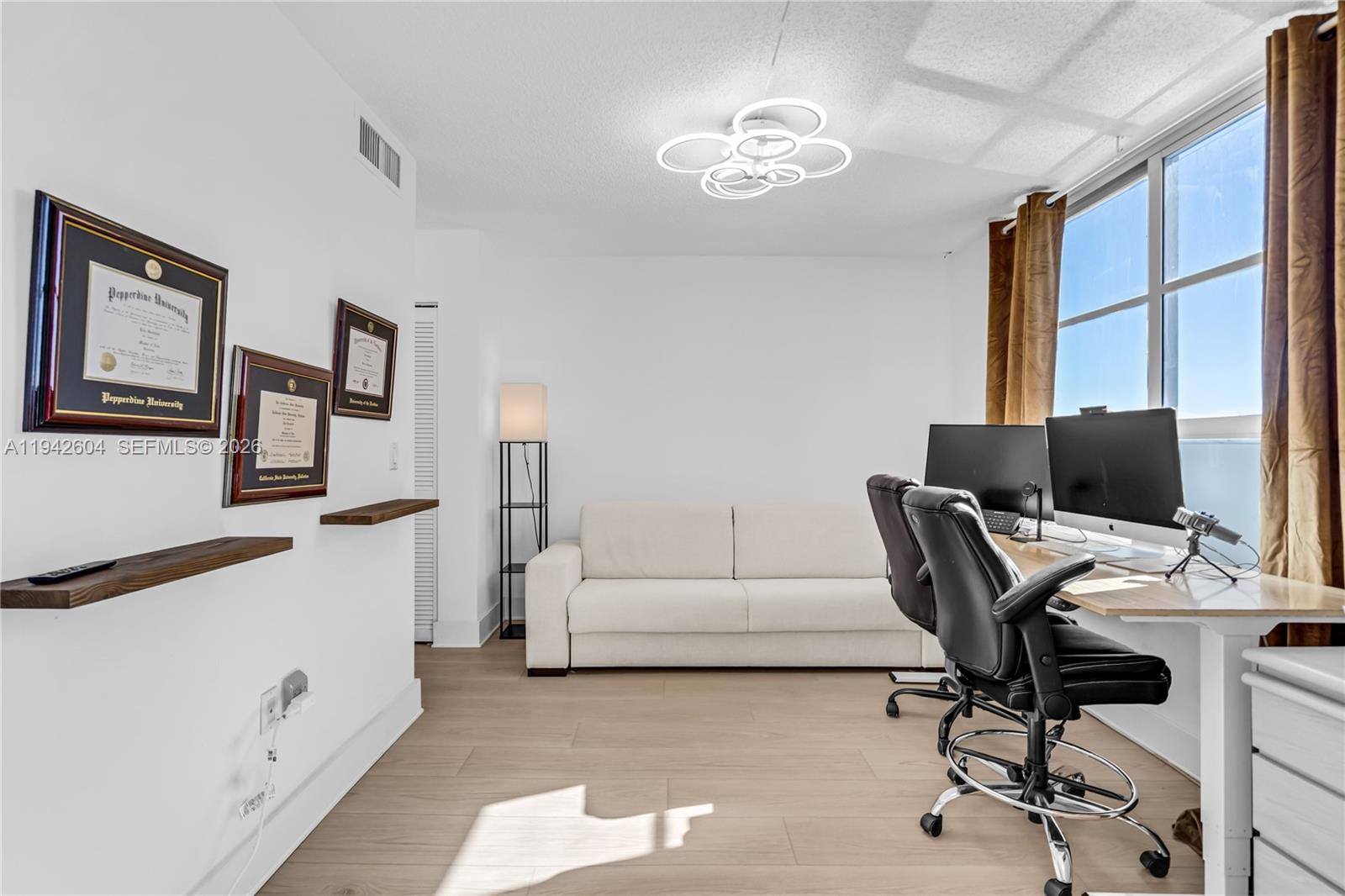 9273 Collins Avenue, Unit 503 Surfside, FL 33154 - Photo 9 of 48 a workspace with furniture and window