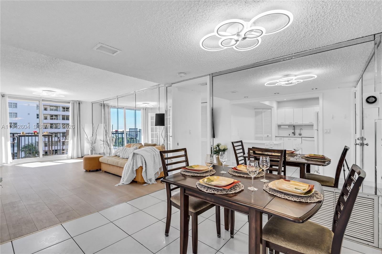 9273 Collins Avenue, Unit 503 Surfside, FL 33154 - Photo 10 of 48 a view of a dining room with furniture