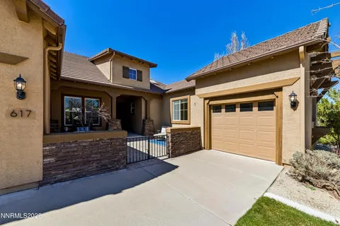 a view of a house with backyard porch and sitting area