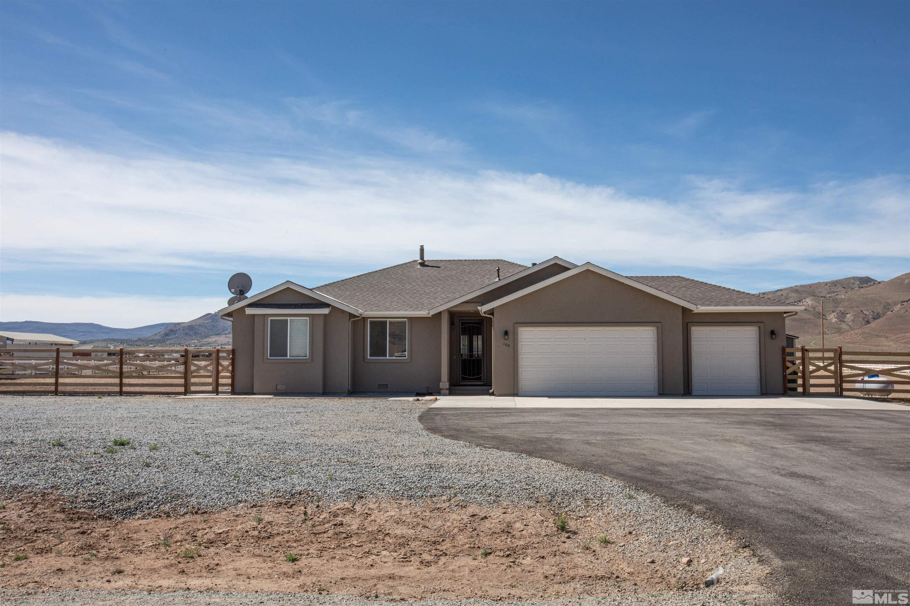 100 Wrangler Ranch Court Reno, NV 89510 - Photo 1 of 35 a front view of a house with a yard