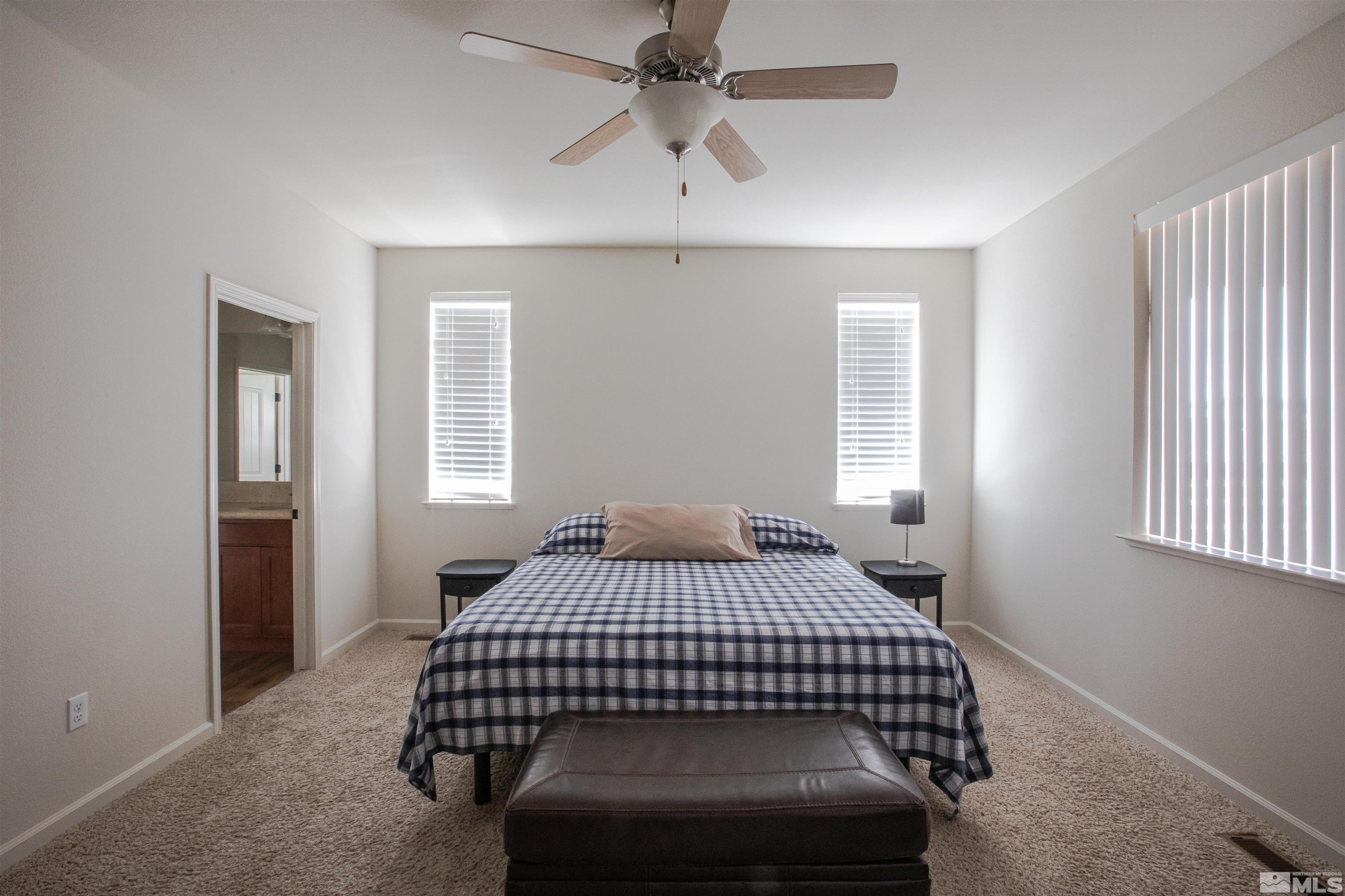 100 Wrangler Ranch Court Reno, NV 89510 - Photo 14 of 35 a bedroom with a bed and window