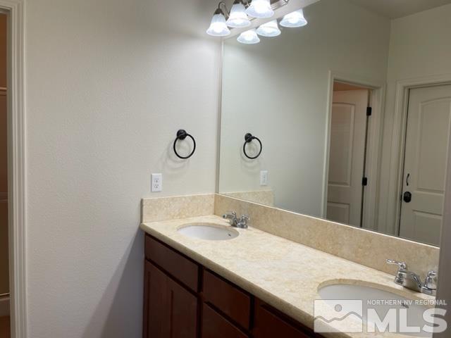 100 Wrangler Ranch Court Reno, NV 89510 - Photo 15 of 35 a bathroom with a sink vanity and a mirror