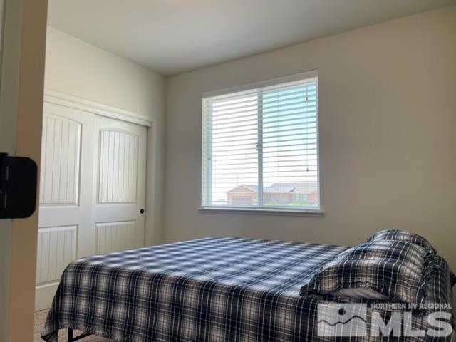 100 Wrangler Ranch Court Reno, NV 89510 - Photo 17 of 35 a bedroom with a bed and window