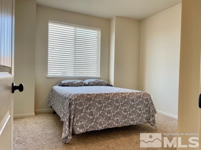 100 Wrangler Ranch Court Reno, NV 89510 - Photo 18 of 35 a bedroom with a bed and a window