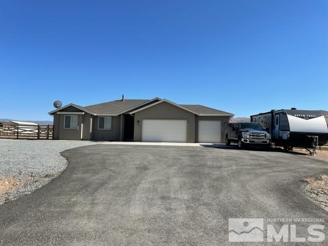 100 Wrangler Ranch Court Reno, NV 89510 - Photo 2 of 35 a front view of a house with a yard and car parked
