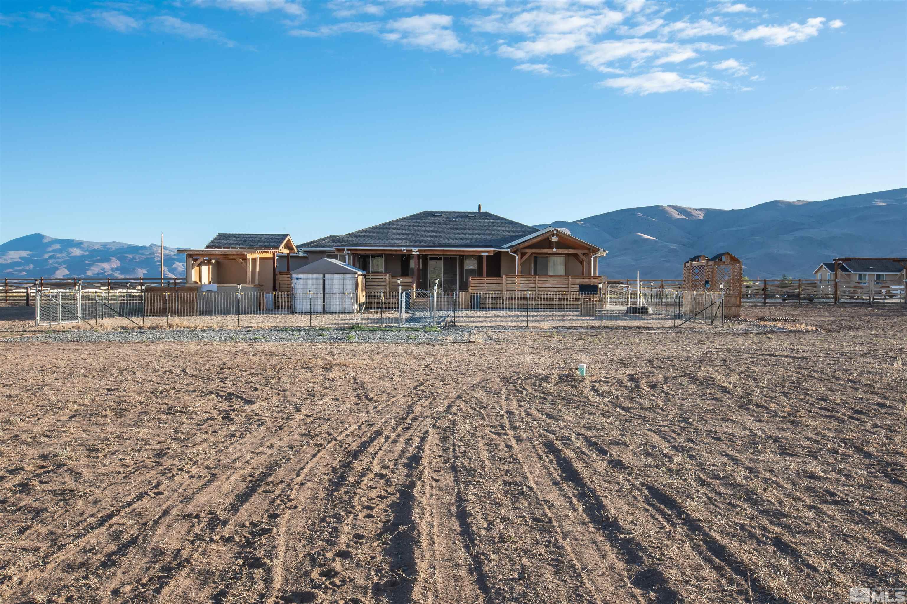 100 Wrangler Ranch Court Reno, NV 89510 - Photo 21 of 35 a front view of a house with a yard