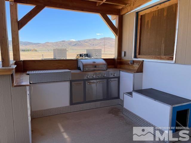 100 Wrangler Ranch Court Reno, NV 89510 - Photo 26 of 35 a kitchen with a stove and a microwave