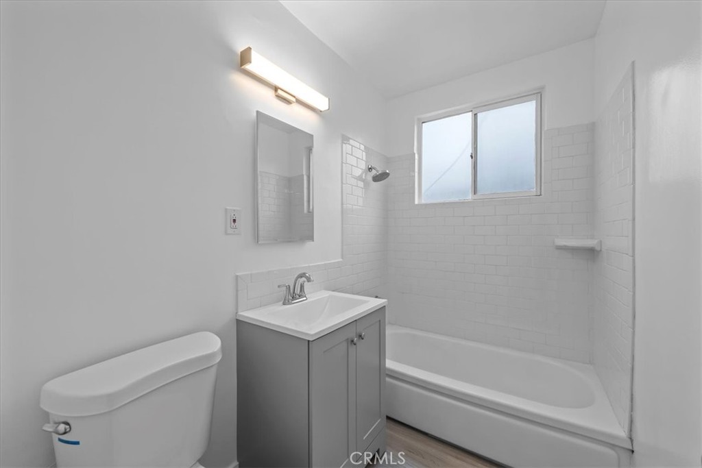853 West 23rd Street, Unit 2 San Pedro, CA 90731 - Photo 16 of 19 a bathroom with a sink a toilet and shower