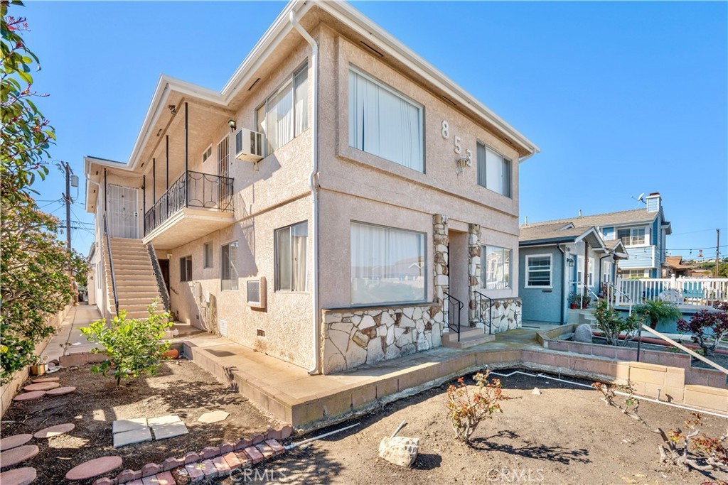 853 West 23rd Street, Unit 2 San Pedro, CA 90731 - Photo 4 of 19 a front view of a house with a yard