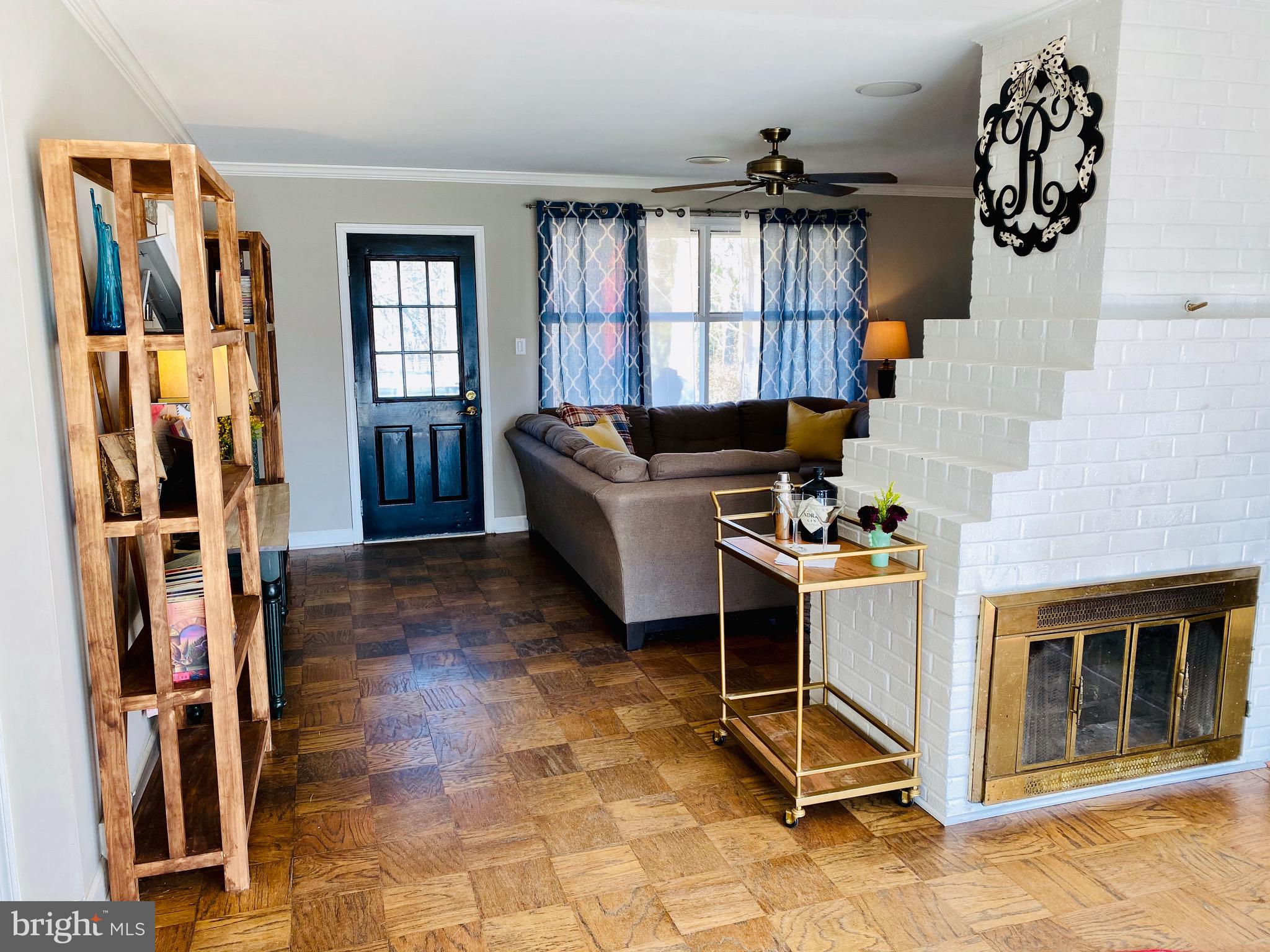 5946 Atteentee Road Springfield, VA 22150 - Photo 6 of 42 Warm entry way with a double sided fireplace.
