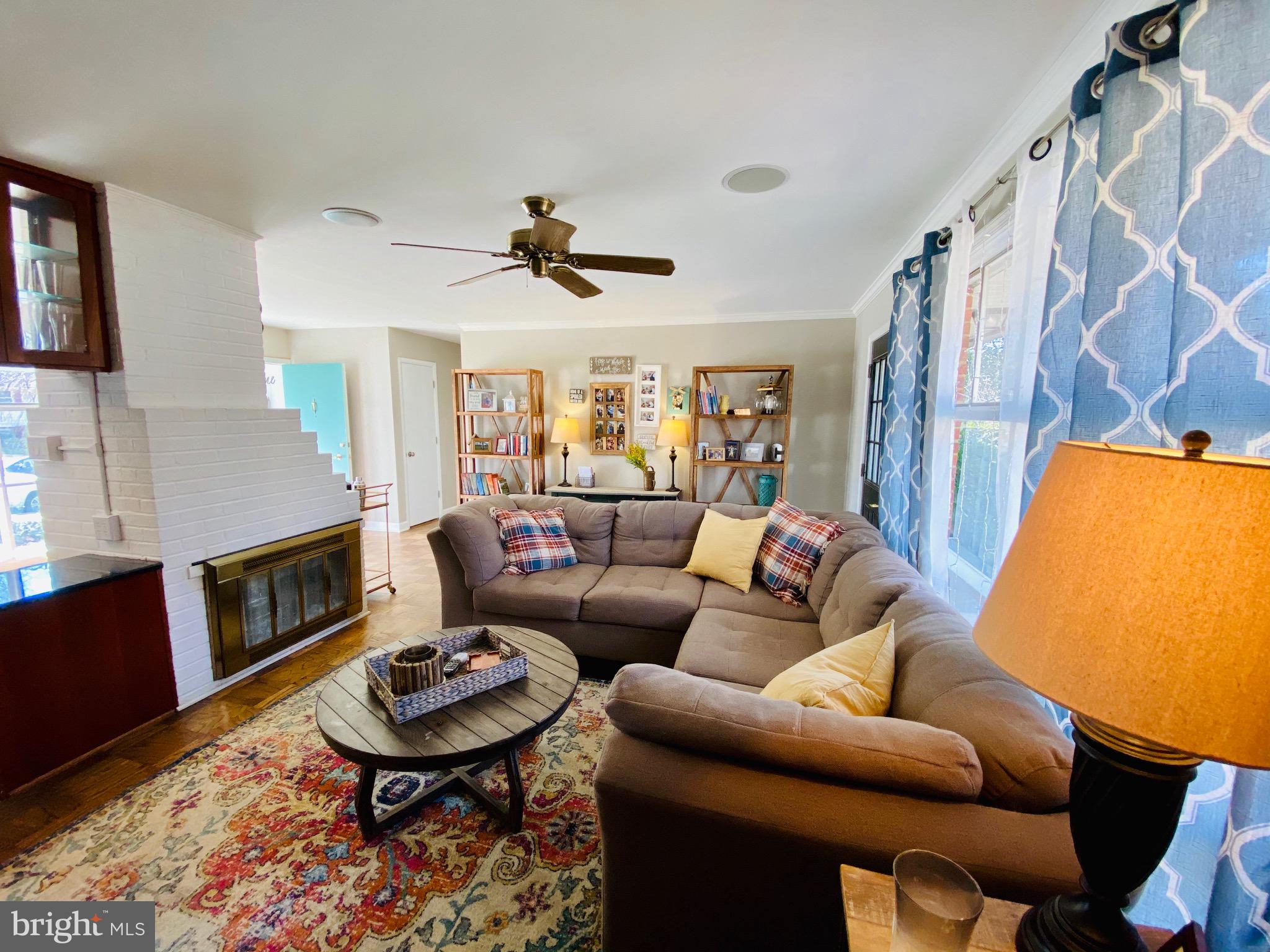 5946 Atteentee Road Springfield, VA 22150 - Photo 9 of 42 Family room with dual sided fireplace