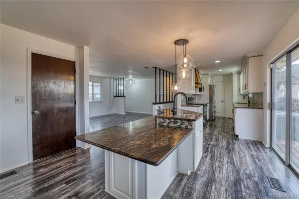 a kitchen with a table and chairs in it
