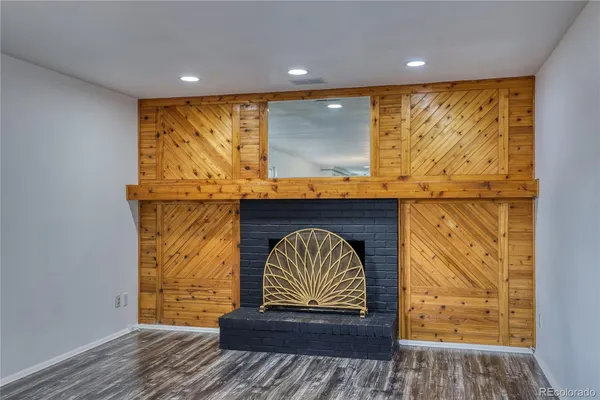 a view of front door with wooden floor