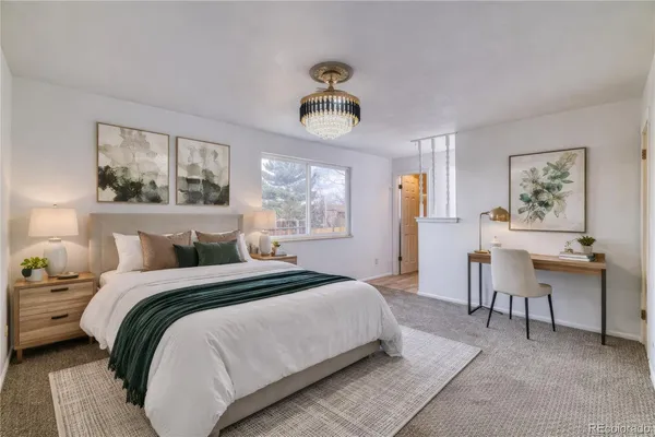 a bedroom with a bed and a table