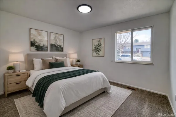 a bedroom with bed and a window