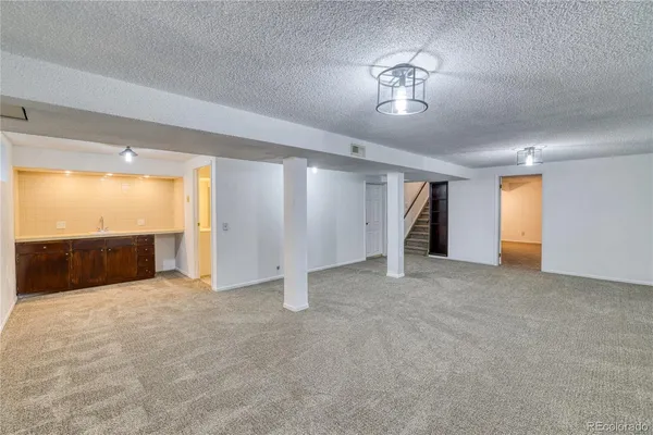 a view of an empty room and a window