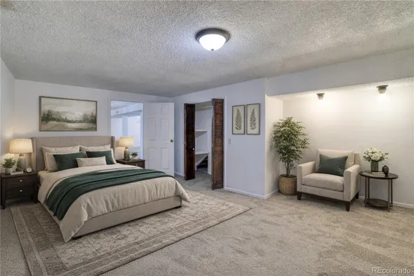 a bedroom with a bed and furniture