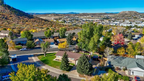 an aerial view of residential houses with outdoor space and swimming pool