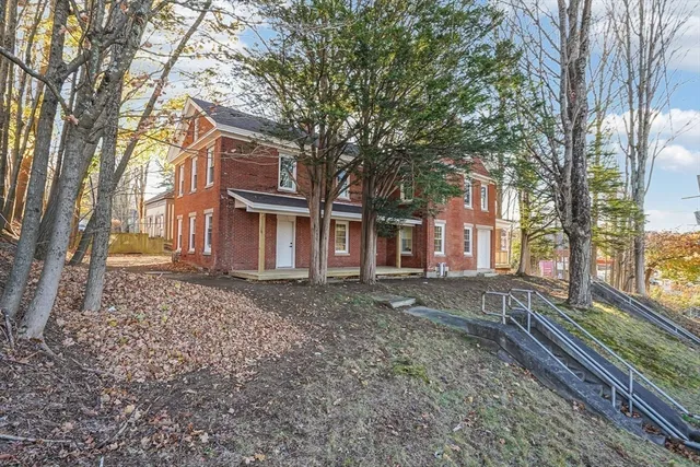 a house with trees in front of it