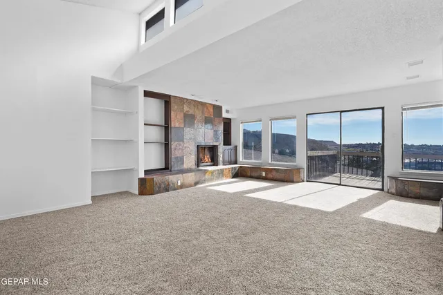 a spacious bathroom with a tub sink and mirror